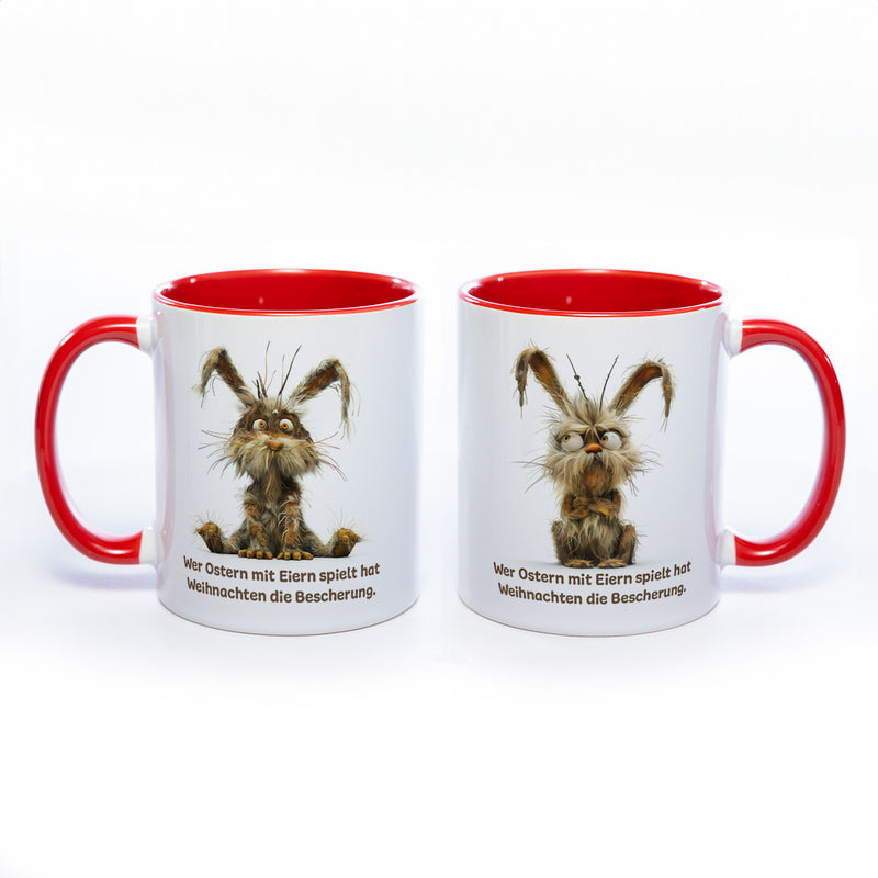 Motiv - Tasse mit Spruch und Hase: Wer Ostern mit Eiern spielt hat Weihnachten die Bescherung.- spülmaschinenfest