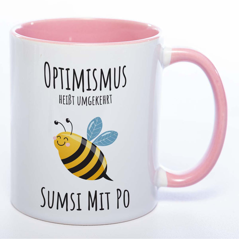 Lustige Tasse „Optimismus – Sumsi mit Po“