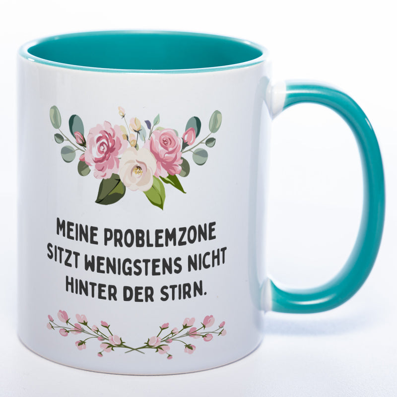 Blümchen-Tasse mit Spruch "Meine Problemzone sitzt wenigstens nicht hinter der Stirn." - Lustige Kaffeetasse spülmaschinenfest