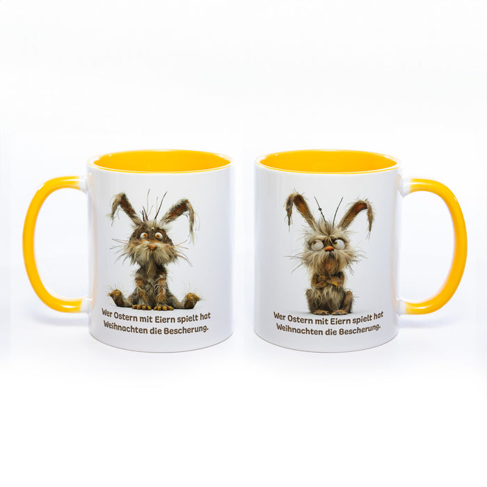 Motiv - Tasse mit Spruch und Hase: Wer Ostern mit Eiern spielt hat Weihnachten die Bescherung.- spülmaschinenfest